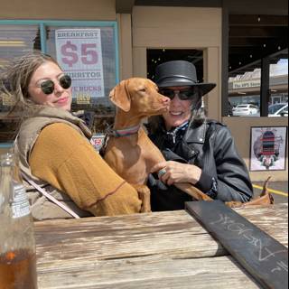 A Woman and Her Hound Enjoy a Refreshing Beverage on the Boardwalk