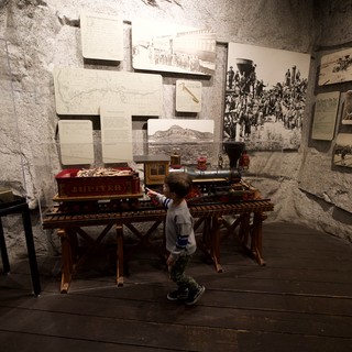 Young Boy Explores Historic Railroad Museum Display