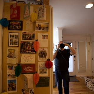 Self-Portrait with Holiday Memory Board at Home