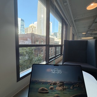 Modern Office Workspace with City Skyline View