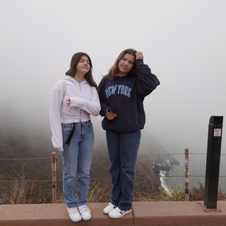 Two Friends in Foggy Scenic Overlook