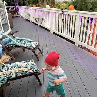 Toddler Dancing on Foggy Morning Deck