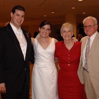 Newlyweds Pose with Family at Wedding Reception