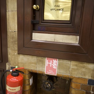 Fire Safety Equipment Cabinet in Historic London Building