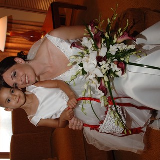 Bride and Flower Girl Share a Tender Wedding Moment