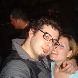 Dave and Penelope Share a Close Moment at a Bar