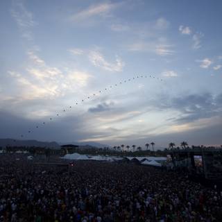 Kite Soaring Above Concert Crowd