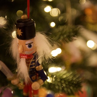 Nutcracker Ornament on Illuminated Christmas Tree