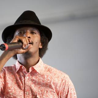 K'Naan Warsame Croons into the Crowd with Fedora and Mic