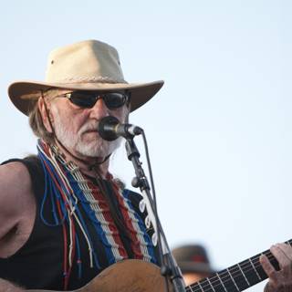 Willie Nelson performs under the blue sky