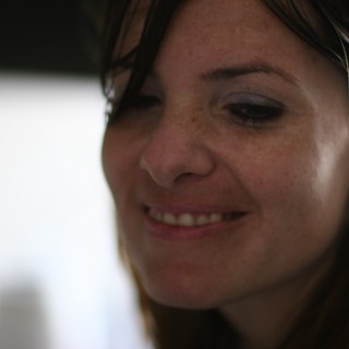 Candid Smile of a Woman in Soft Light