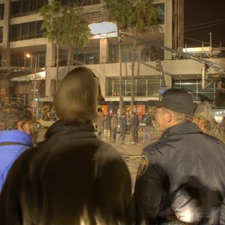 Nighttime Crowd Gathers in Metropolis