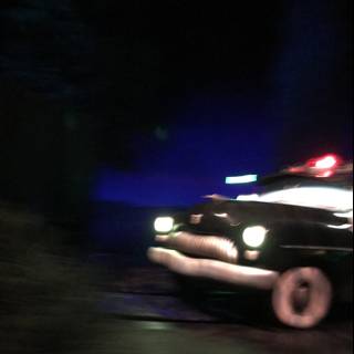 Police Car on the Move at Night