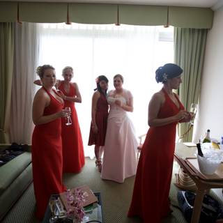 Group of Women in Red Dresses Standing in a Formal Living Room