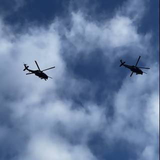 Helicopters Soaring Through Clouds