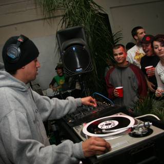DJ Raul R Entertaining the Crowd in his Grey Hoodie