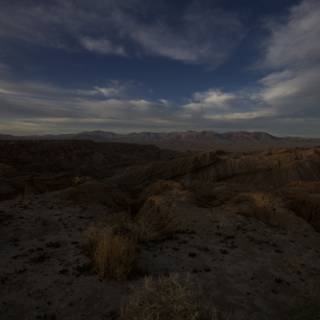 Desert Sunset Amidst Mountain Peaks