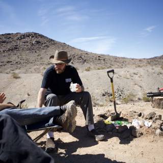 Man Digging in the Desert Heat