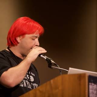 Red-Haired Man with a Microphone