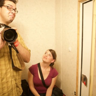 Photographers at Work in Hallway Mirror
