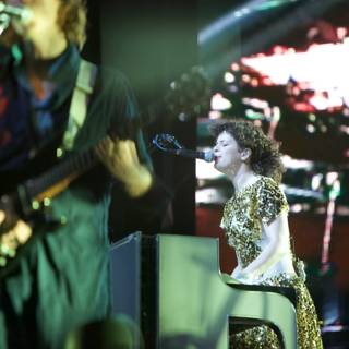 Régine Chassagne electrifies Coachella stage with gold dress and keyboard