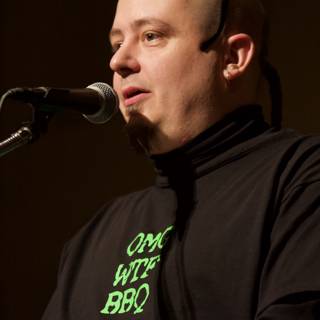 Green Shirted Entertainer Commands the Stage