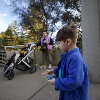 Boy Reading Brochure at Chabot Space and Science Center