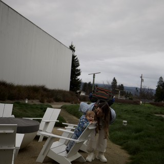 Playful Mother and Child Moment at Outdoor Venue