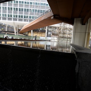 Reflective Pool Under Modern Architectural Canopy in London