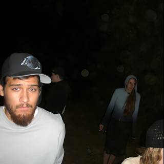 Nighttime Portrait of Four People with Baseball Caps