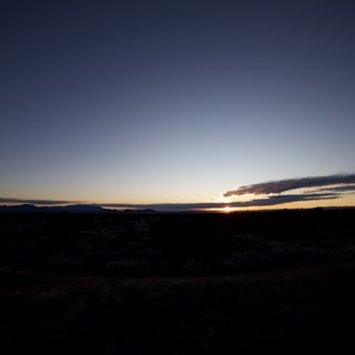 Desert Twilight Over Mountain Silhouettes at Dusk