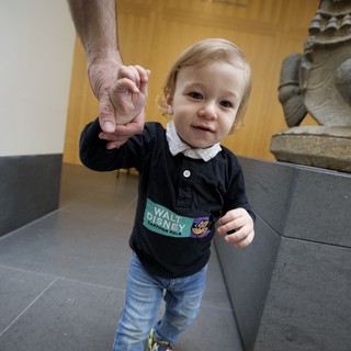Toddler Holding Adult's Hand at Asian Art Museum