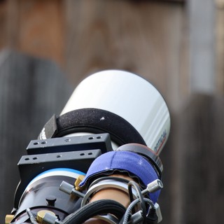 Close-Up of Camera Lens with Blue Hood Attachment