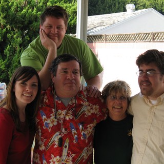 Family Christmas Gathering in Backyard Setting