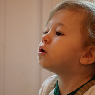 Curious Toddler Gazing at Christmas Lights
