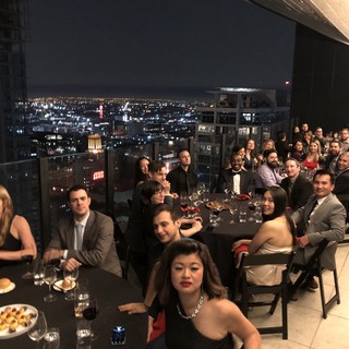 Elegant Rooftop Gala Dinner with City Skyline