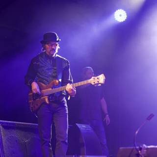 Les Claypool Shreds on Stage with His Guitar