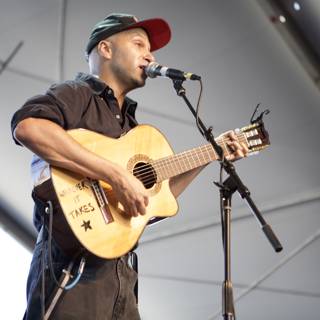 Tom Morello Rocks Coachella Stage with Electric Guitar and Microphone