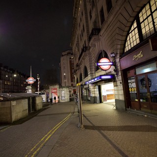 Empty London Street at Night with Underground Station