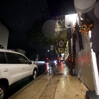 Rainy Night on a Quiet Urban Sidewalk