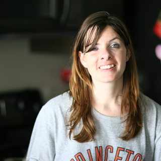 Candid Kitchen Portrait of Smiling Young Woman