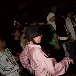 Partygoer in Pink Hat Grooving