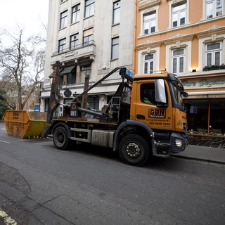 Skip Hire Truck Servicing Urban London Street