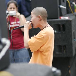 Bald Boy with Mic Takes the Stage