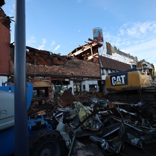Demolition Site with CAT Excavator Clearing Debris