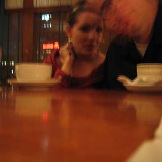 Intimate Couple Sharing a Quiet Café Moment