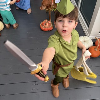Young Boy in Peter Pan Costume with Sword