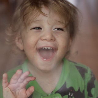Joyful Toddler with Bright Smile and Messy Hair