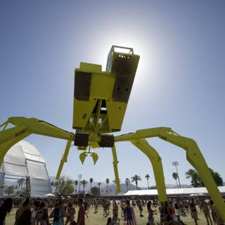 Giant Yellow Spider Sculpture Stands Tall in the Middle of a Crowd