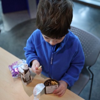 Young Boy Enjoying Snack at Chabot Science Center